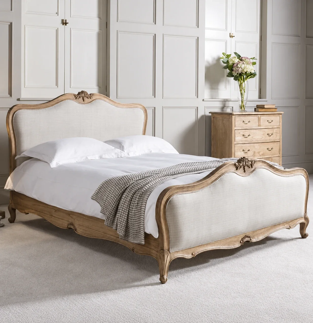 AI-retouched reference image of an upholstered carved bed in a light bedroom
