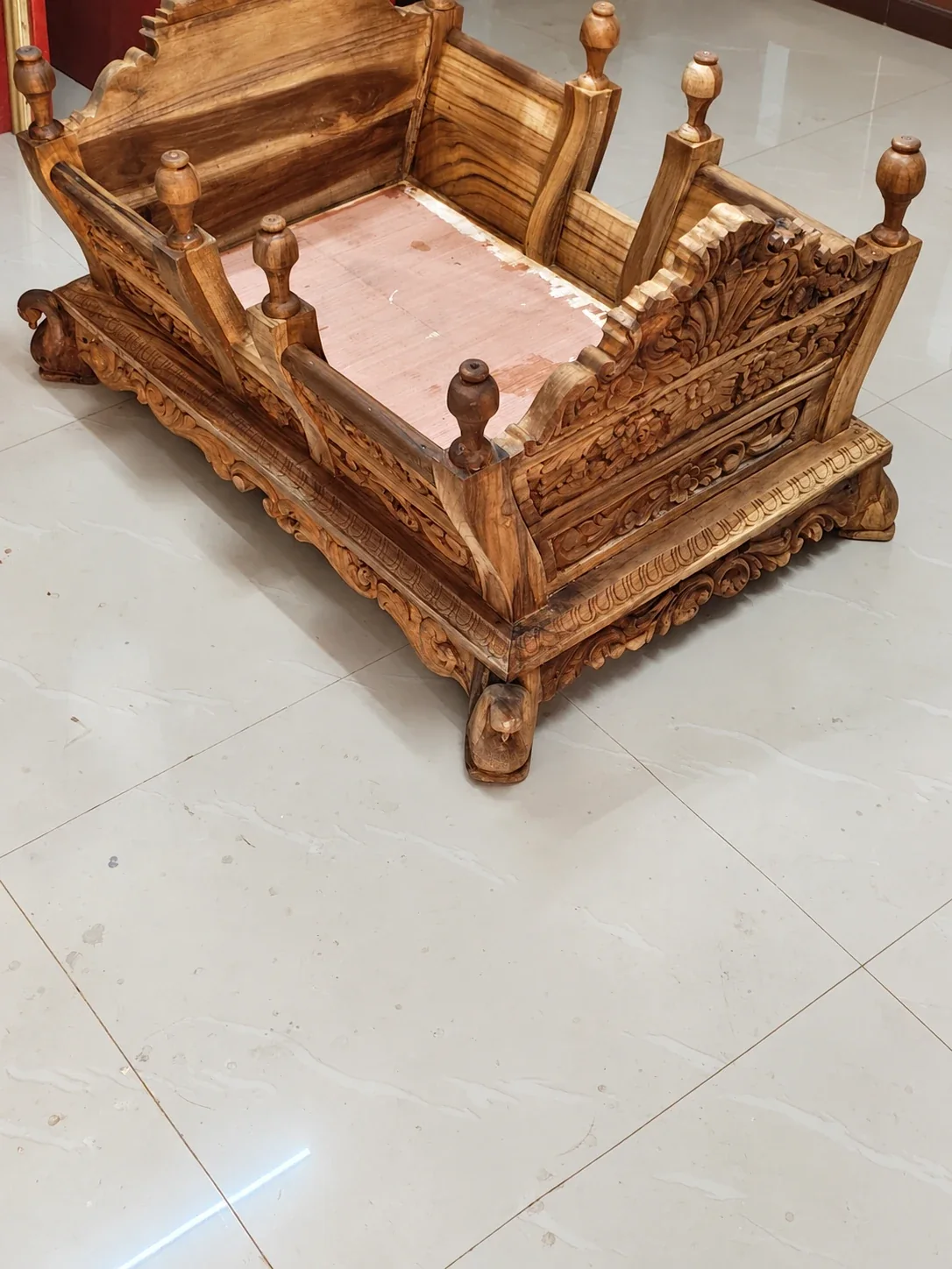 AI-retouched project photograph of a carved wooden palki with people removed